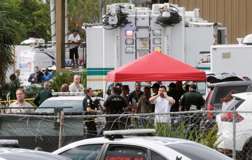 Deputies and other law enforcement officials at the scene in Orlando, Monday.png
